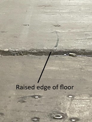 raised edge of concrete slab